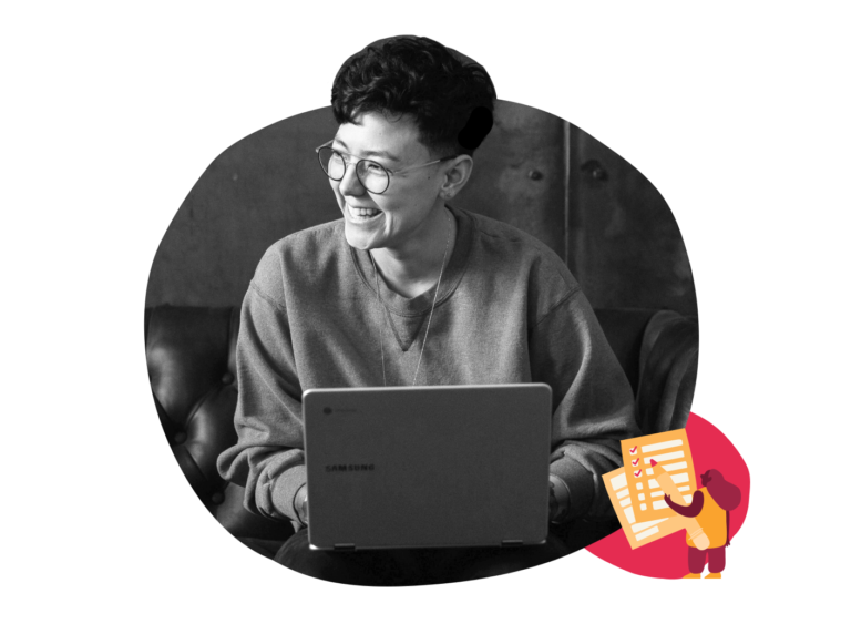 smiling person using a laptop in casual attire, modern workspace with creative elements and joyful atmosphere